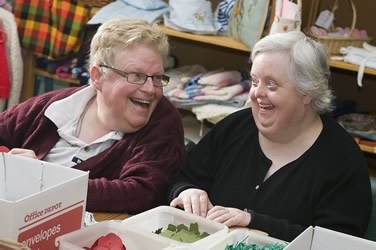 Two ladies making poppies